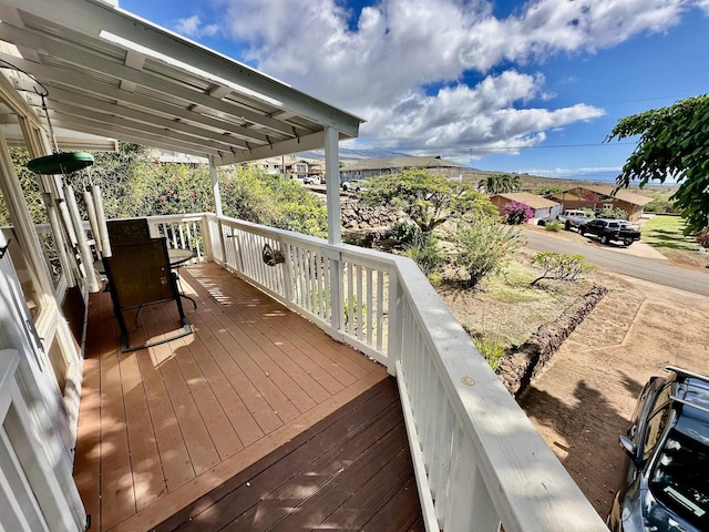 wooden deck with a mountain view