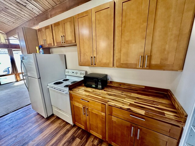 kitchen with dark wood-type flooring and white appliances