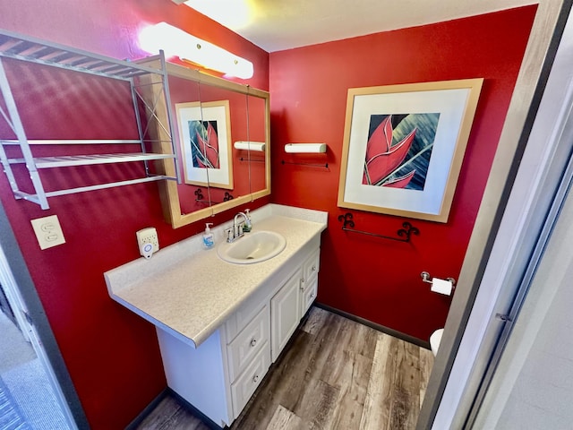 bathroom featuring vanity and hardwood / wood-style flooring