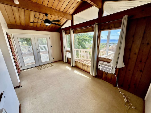 unfurnished sunroom featuring french doors, a wealth of natural light, wood ceiling, and vaulted ceiling with beams