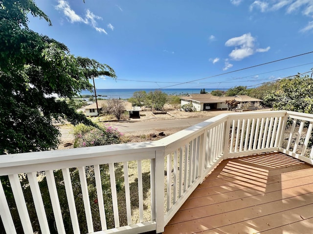 wooden deck with a water view