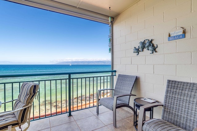 balcony featuring a water view