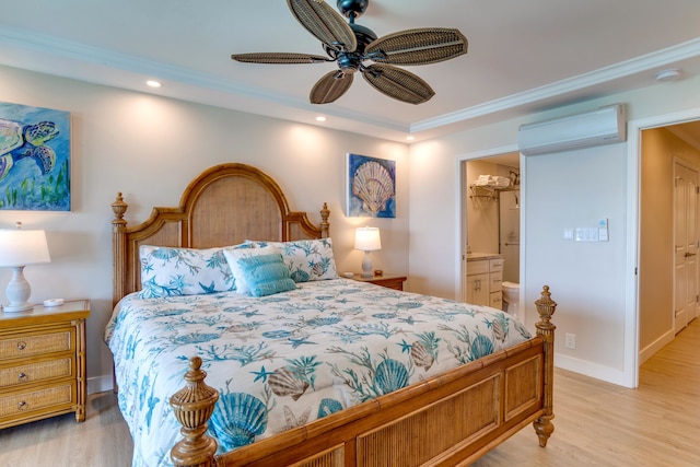 bedroom with ensuite bath, ornamental molding, a wall mounted AC, ceiling fan, and light hardwood / wood-style floors