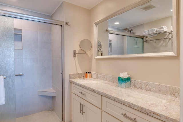 bathroom with vanity and an enclosed shower