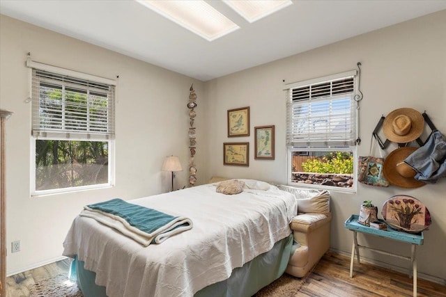 bedroom with wood-type flooring