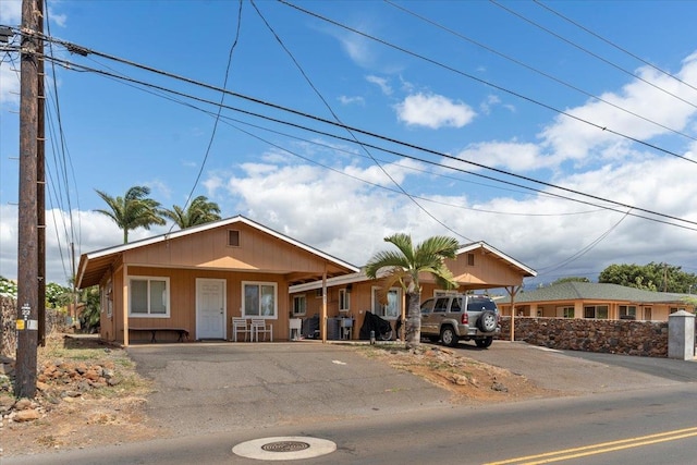 view of front of house featuring a carport