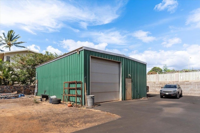 view of outdoor structure featuring a garage