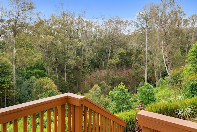 1733 Piiholo Rd, Makawao, HI 96768 - wooden terrace featuring a wooded view