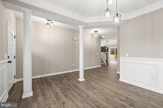 interior space with stairs, ornamental molding, dark wood-style floors, and baseboards