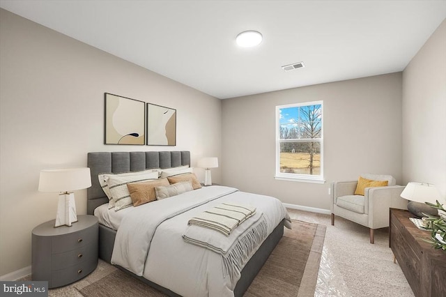 bedroom with carpet flooring, visible vents, and baseboards