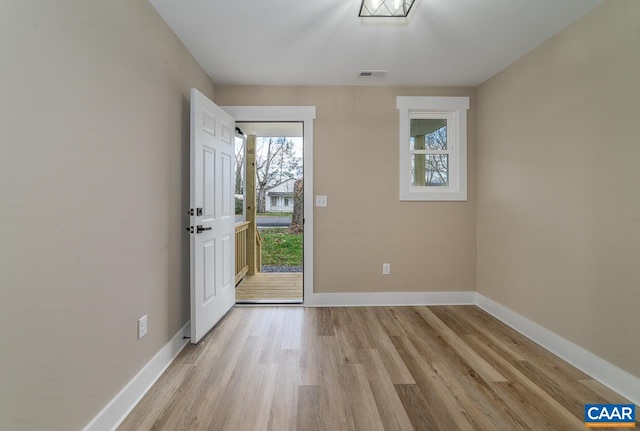 foyer entrance with light wood-type flooring