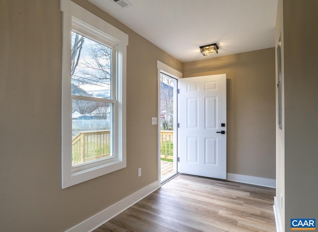 foyer entrance featuring light wood-type flooring