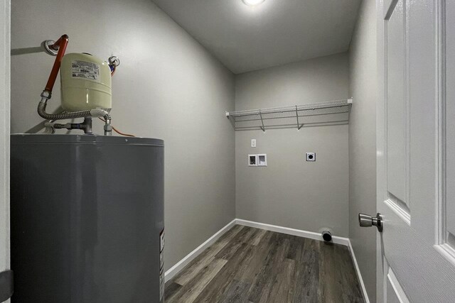 laundry area with electric dryer hookup, washer hookup, water heater, and dark hardwood / wood-style floors