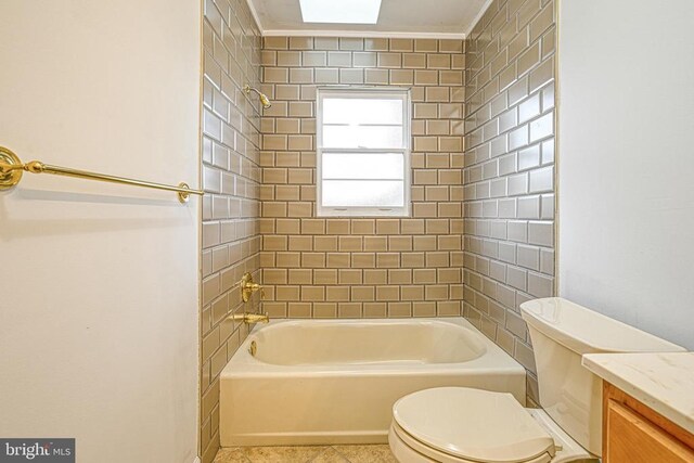 full bathroom with vanity, tile patterned flooring, tiled shower / bath combo, and toilet