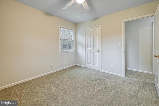 unfurnished bedroom with light carpet and ceiling fan