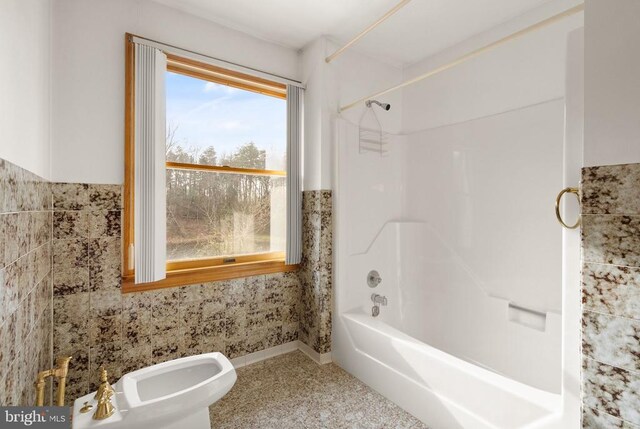 full bath with a bidet and shower / washtub combination