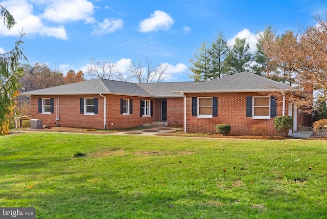 ranch-style house featuring a front lawn, brick siding, and central air condition unit