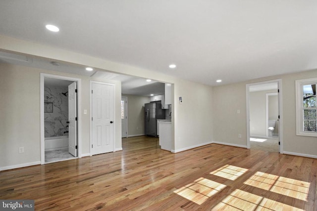 unfurnished living room featuring light hardwood / wood-style flooring