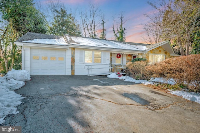 ranch-style house featuring a garage