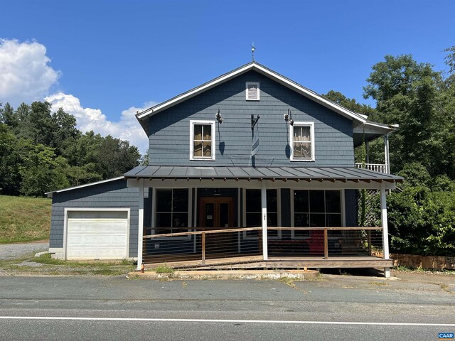 view of front of home featuring a garage and covered porch