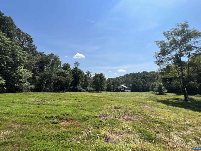 view of yard with a rural view