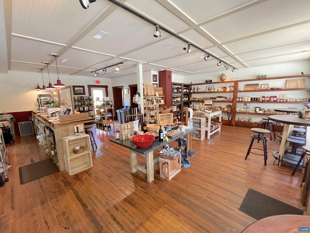 misc room featuring hardwood / wood-style floors and track lighting