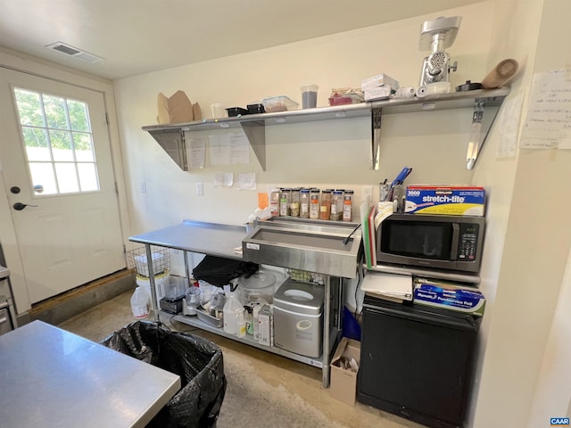 kitchen featuring concrete flooring