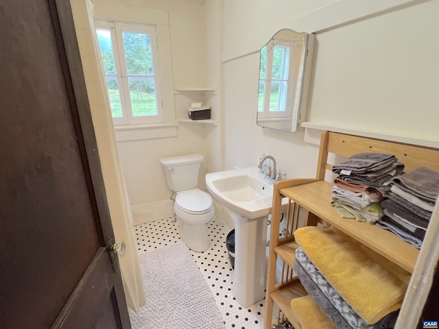 bathroom featuring tile patterned flooring and toilet