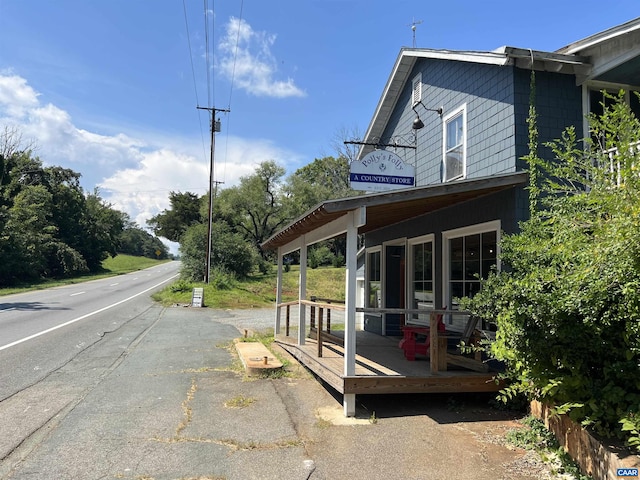 view of side of home featuring a porch