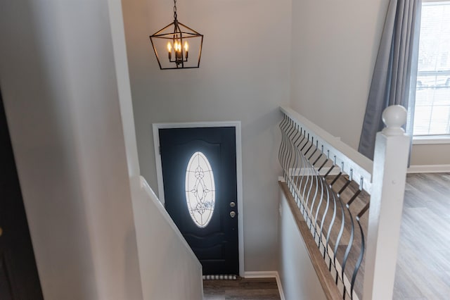 entryway with an inviting chandelier and hardwood / wood-style floors