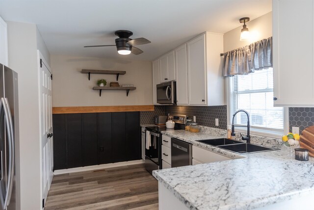 washroom featuring independent washer and dryer and cabinets