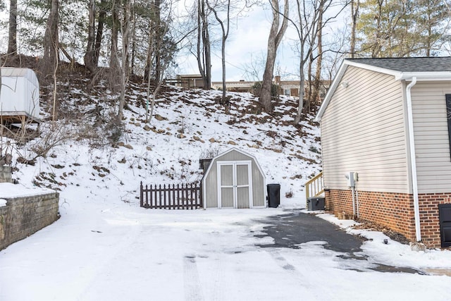 exterior space with central AC and a shed