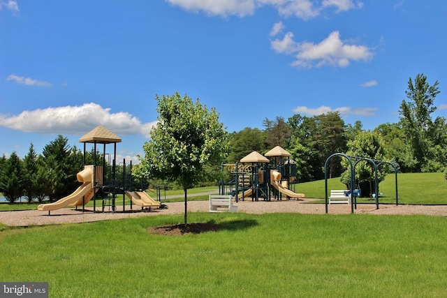 view of jungle gym featuring a lawn