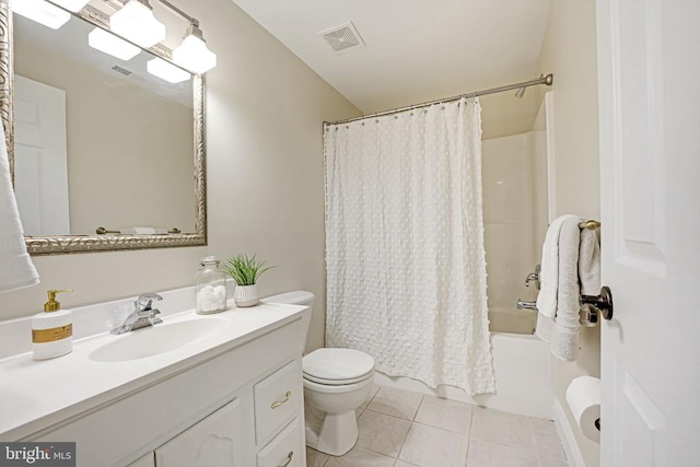 full bathroom featuring tile patterned flooring, vanity, toilet, and shower / bath combo with shower curtain