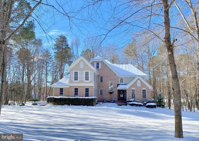 view of front of property with a garage and a front yard