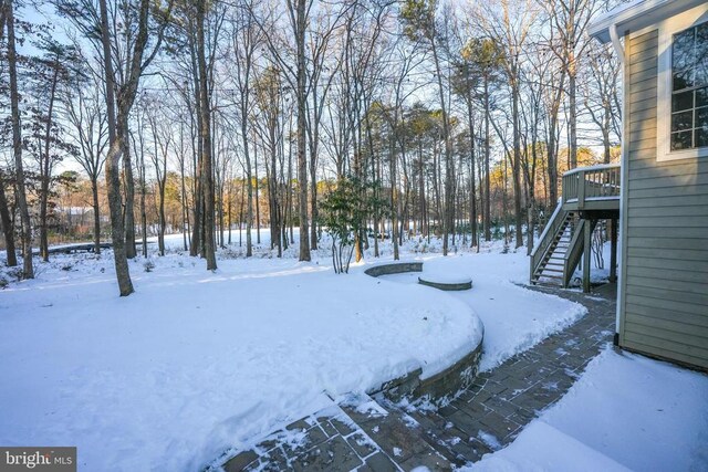 view of yard with a patio area and an outdoor living space with a fire pit