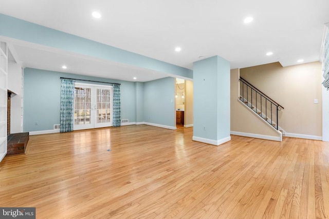 unfurnished living room with light hardwood / wood-style floors