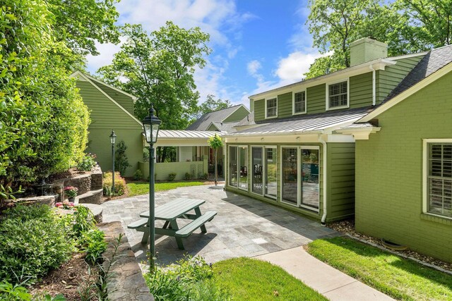 rear view of property with a patio area