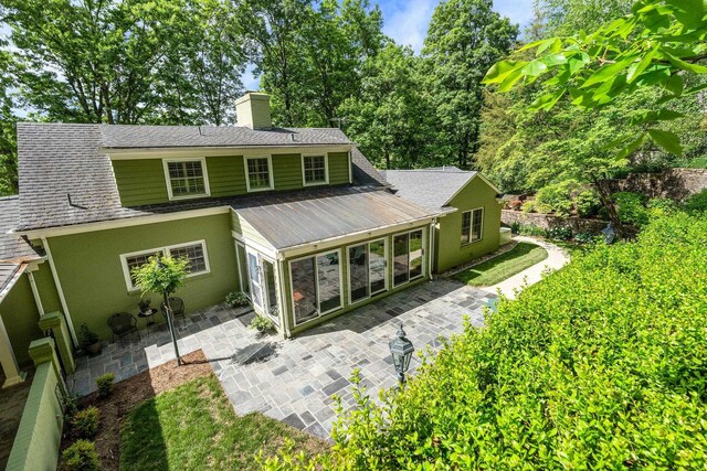 rear view of house featuring a patio area