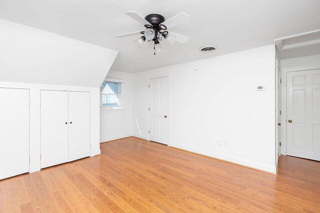 additional living space featuring ceiling fan and light hardwood / wood-style flooring