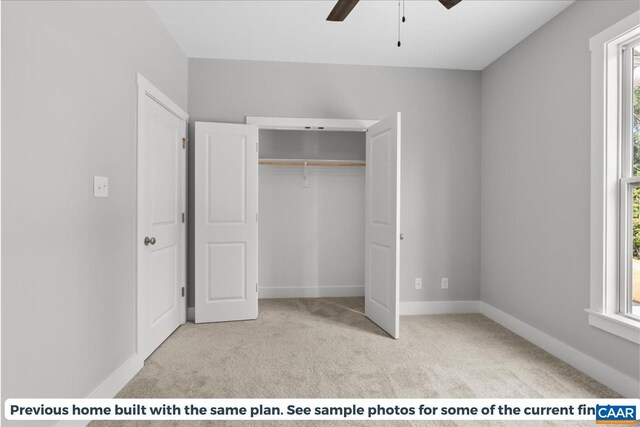 unfurnished bedroom with light carpet, ceiling fan, and a closet