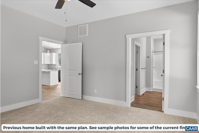 unfurnished bedroom featuring light colored carpet