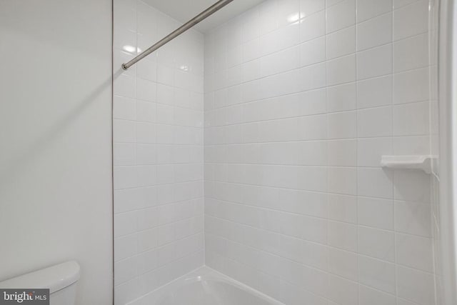 full bath with shower / bath combination and toilet