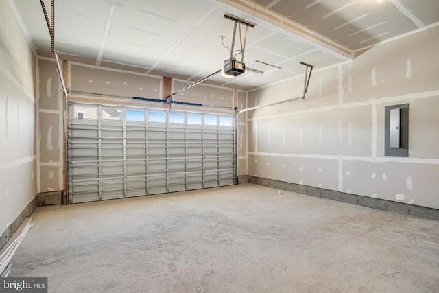 garage featuring electric panel and a garage door opener