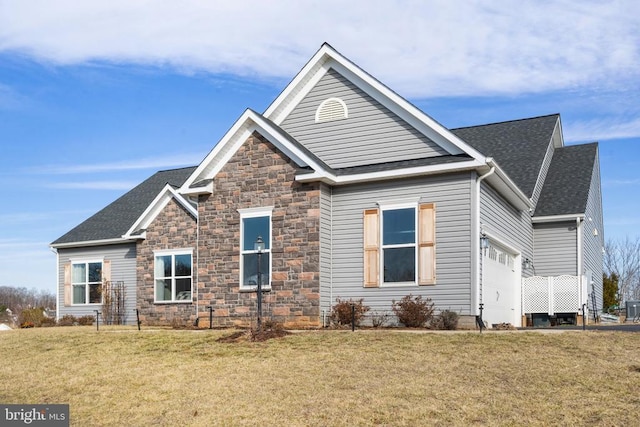 exterior space featuring a garage and a front lawn