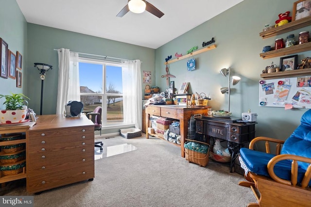 carpeted home office with ceiling fan