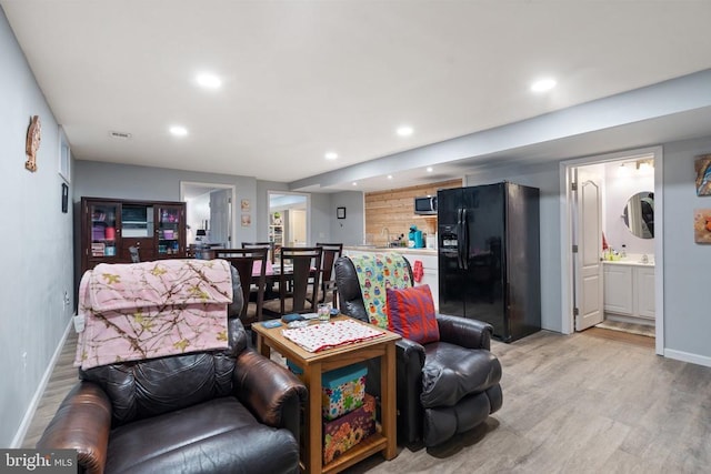 living room with light hardwood / wood-style floors