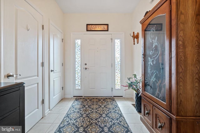 foyer featuring light tile patterned floors