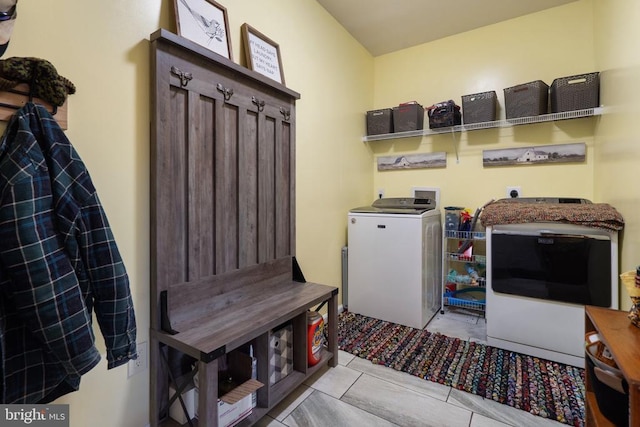 laundry area with separate washer and dryer