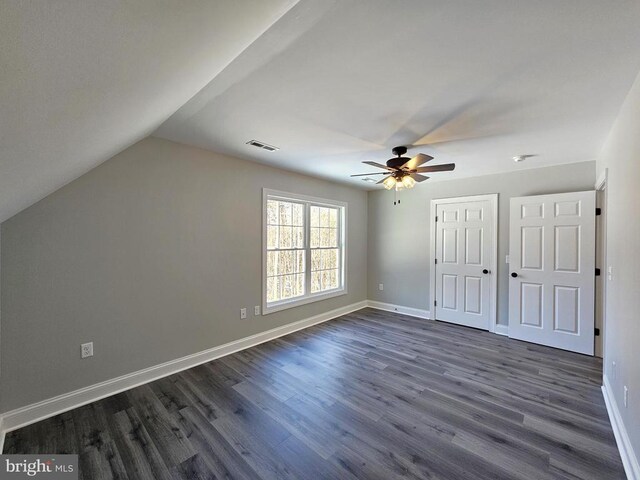 entrance foyer featuring ceiling fan, dark hardwood / wood-style floors, and high vaulted ceiling